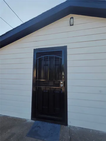 a kitchen with stainless steel appliances a refrigerator and a stove top oven