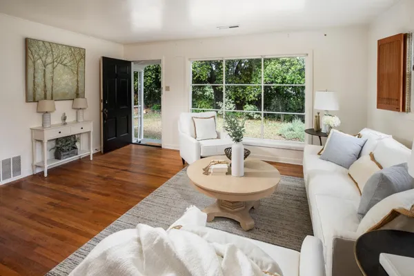 a living room with furniture and a large window