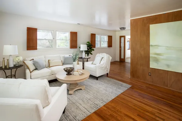 a living room with furniture and a table