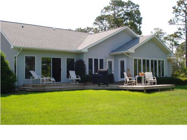 484 Shipwreck Road Santa Rosa Beach, FL 32459 - Photo 6 of 15 a view of a patio with couches chairs and swimming pool with a barbeque grill