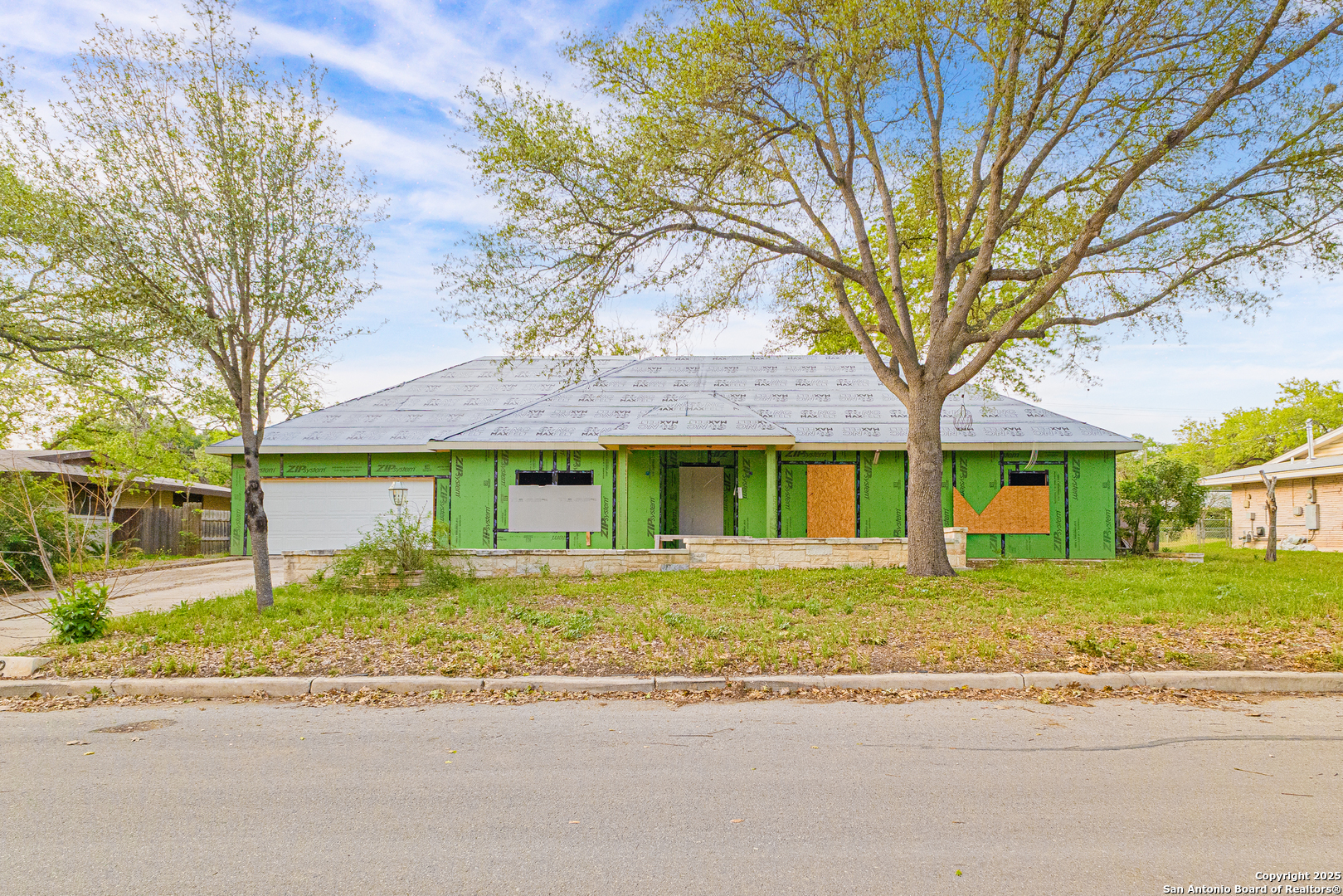 front view of a house with a trees