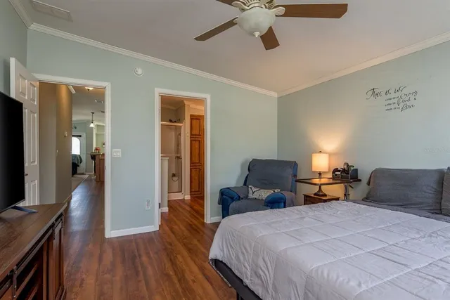 a bathroom with a granite countertop sink two mirror and shower