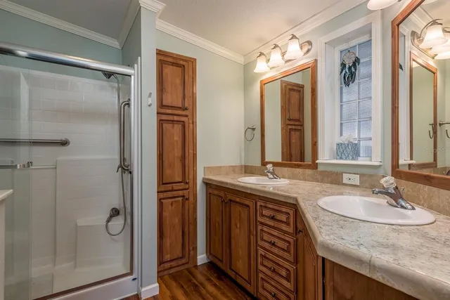 a bedroom with bed and a flat screen tv