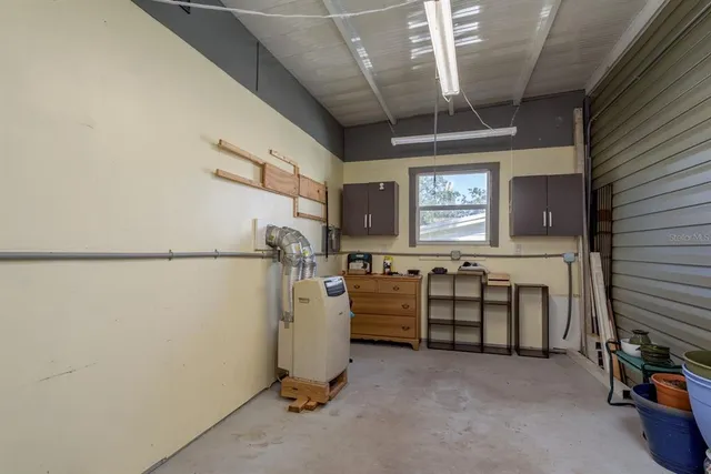 a view of a house with backyard and porch