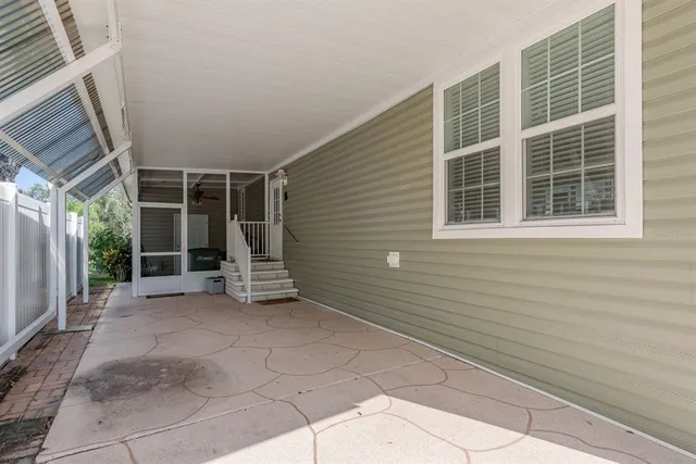 an aerial view of a house with a yard basket ball court and outdoor seating