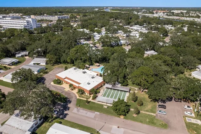 an aerial view of a house with outdoor space and lake view