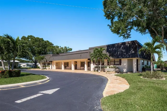a view of a house with a big yard