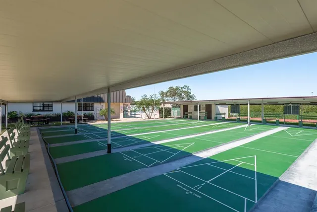 swimming pool view with a seating space