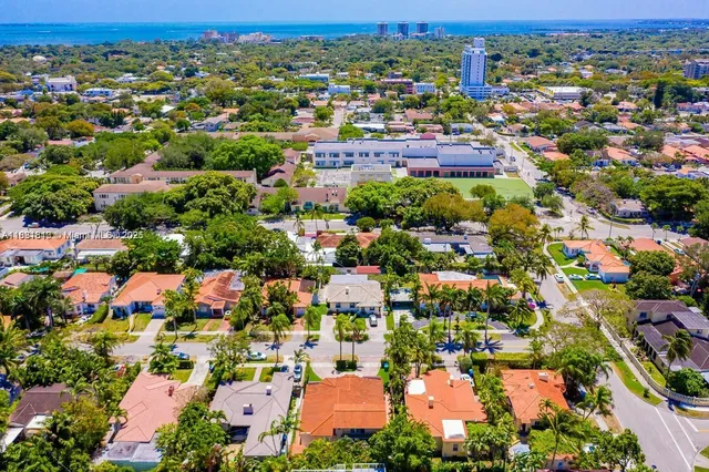 an aerial view of residential houses with outdoor space