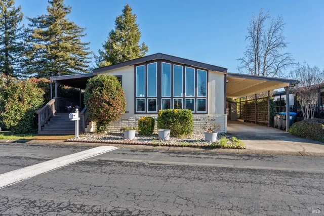 a front view of a house having garden