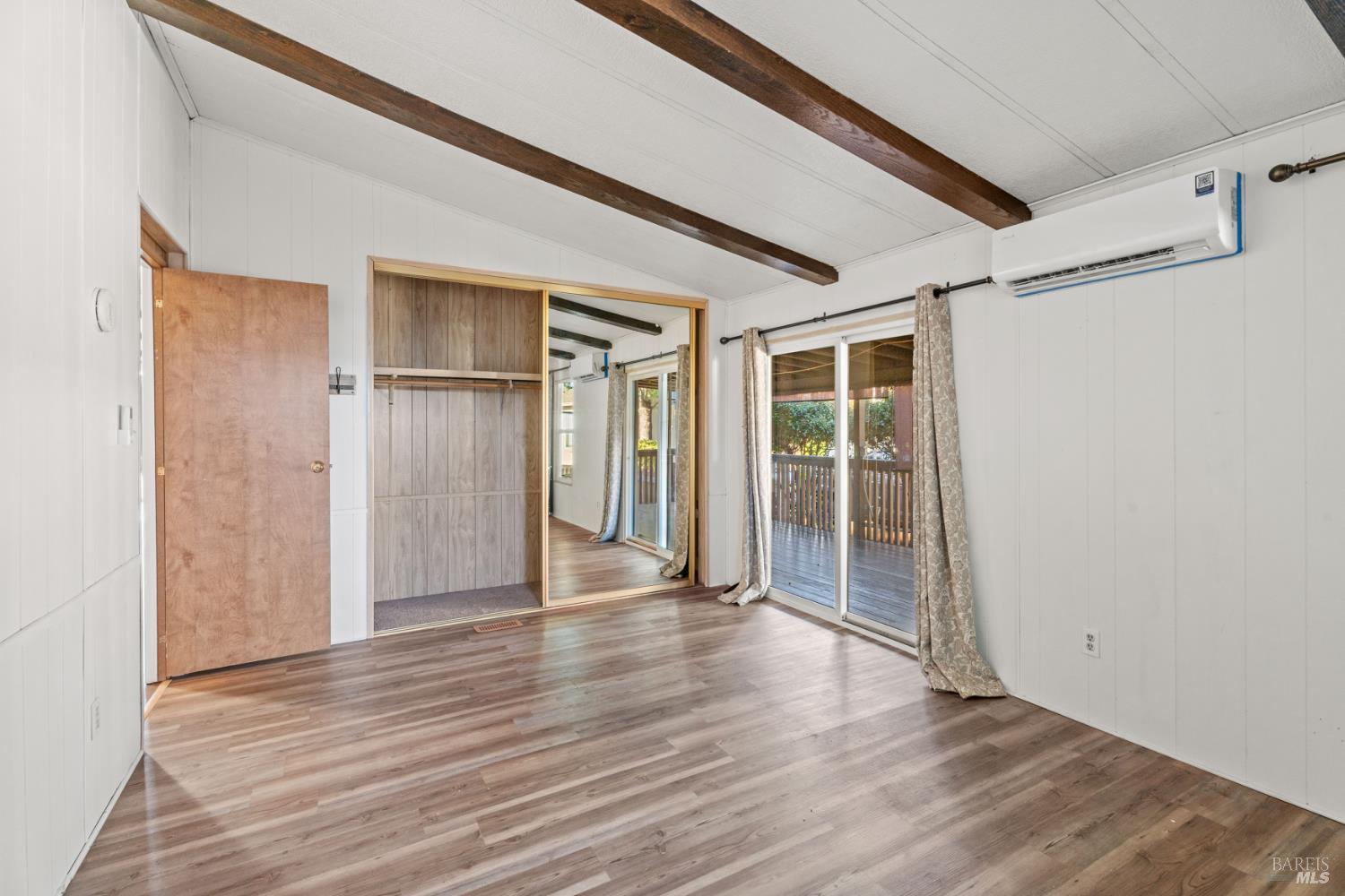 51 Rancho Grande Drive Ukiah, CA 95482 - Photo 13 of 24 a view of an empty room with wooden floor and a window