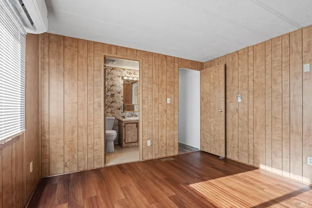a view of wooden floor and windows in a room