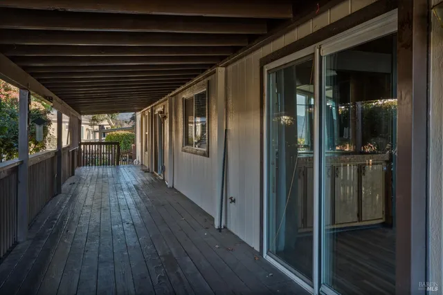 a view of outdoor space with wooden floor and staircase