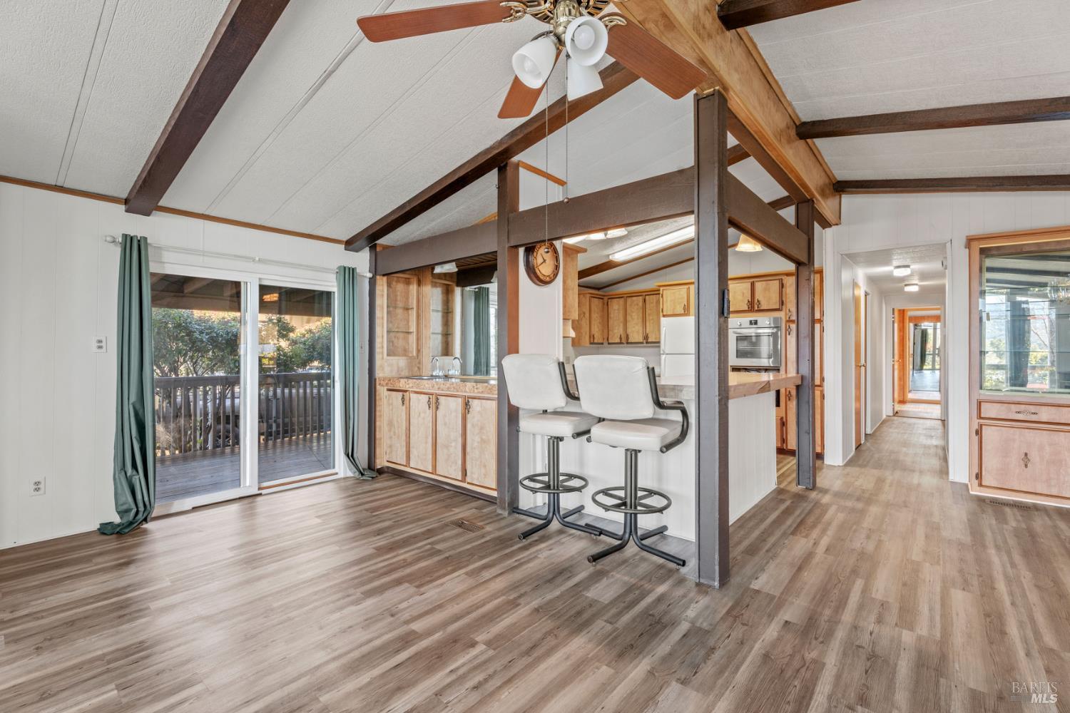 51 Rancho Grande Drive Ukiah, CA 95482 - Photo 5 of 24 a view of a hallway with wooden floor and furniture