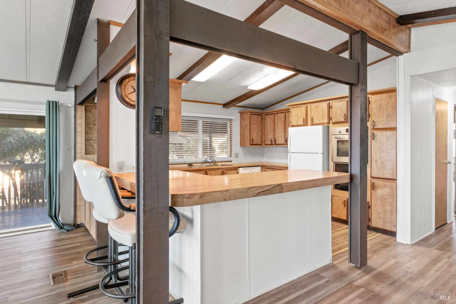 51 Rancho Grande Drive Ukiah, CA 95482 - Photo 9 of 24 a kitchen view with a stove and wooden floor