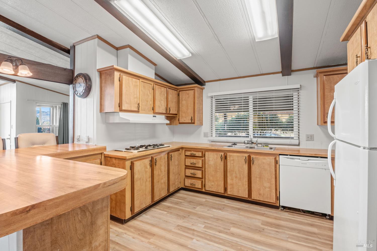 51 Rancho Grande Drive Ukiah, CA 95482 - Photo 10 of 24 a kitchen with stainless steel appliances granite countertop a sink stove and refrigerator