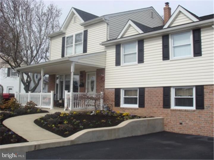 445 Kennerly Road Springfield, PA 19064 - Photo 2 of 9 a front view of a house with yard