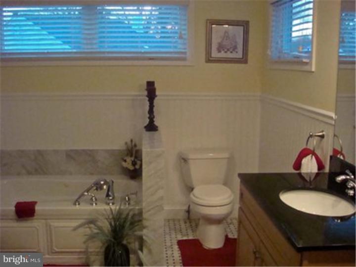 445 Kennerly Road Springfield, PA 19064 - Photo 7 of 9 a bathroom with a toilet and a sink