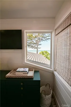 a bathroom with a sink a toilet and a window