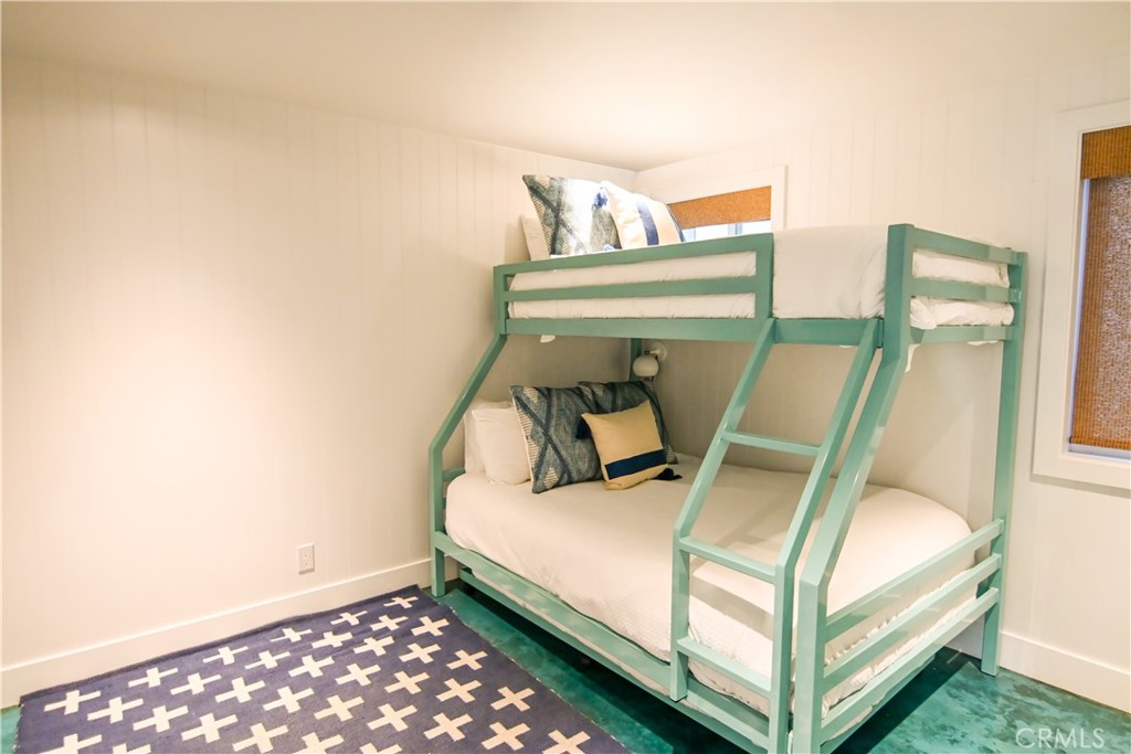 2814 Studio Drive Cayucos, CA 93430 - Photo 21 of 32 a bed sitting in a bedroom next to a window