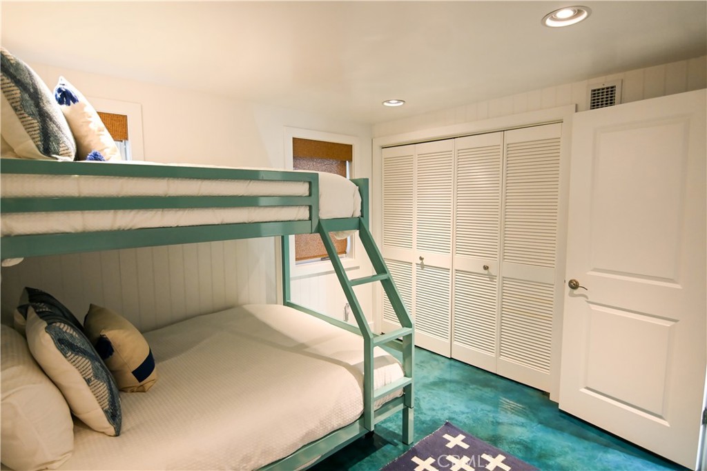 2814 Studio Drive Cayucos, CA 93430 - Photo 22 of 32 a bedroom with a bed and a window