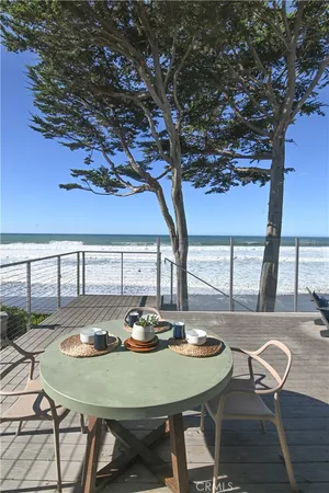a view of a dining table and chairs in the patio