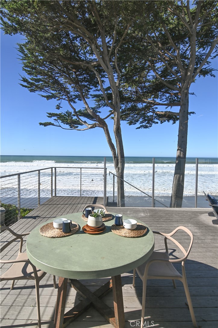 2814 Studio Drive Cayucos, CA 93430 - Photo 3 of 32 a view of a dining table and chairs in the patio