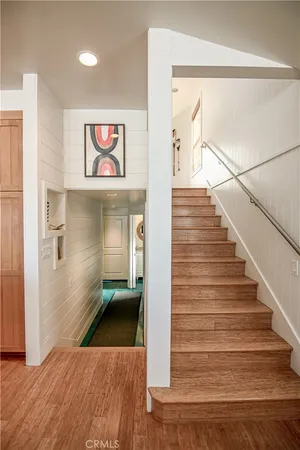 a view of a hallway with stairs