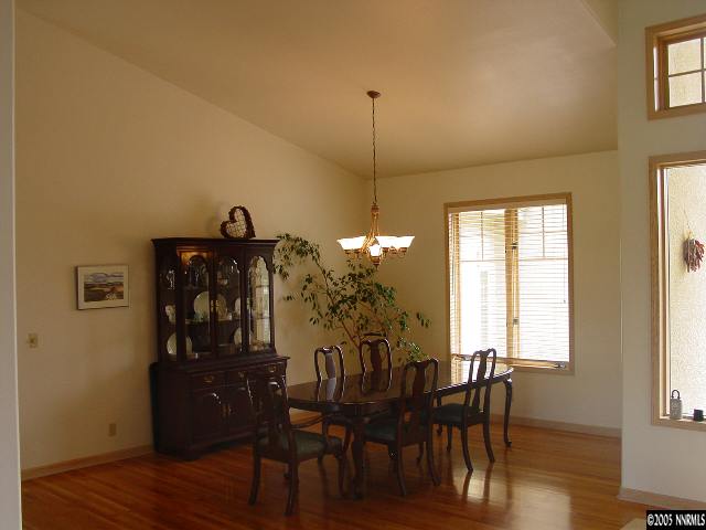 4475 Plateau Road Reno, NV 89519 - Photo 2 of 9 a view of a dining room with furniture and wooden floor