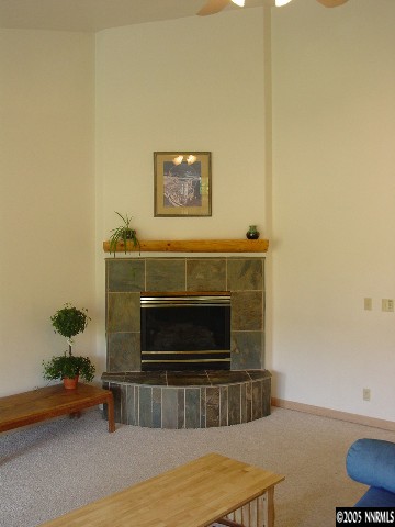 4475 Plateau Road Reno, NV 89519 - Photo 3 of 9 a living room with furniture and a fireplace