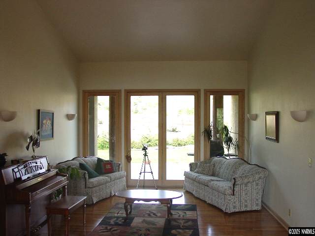 4475 Plateau Road Reno, NV 89519 - Photo 4 of 9 a living room with furniture and a large window