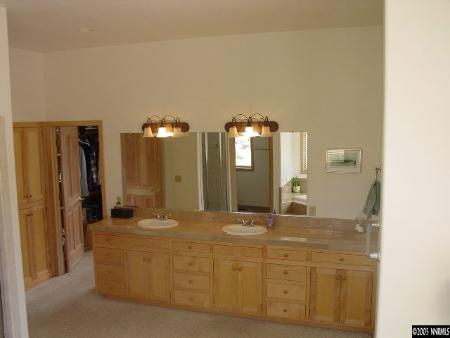 4475 Plateau Road Reno, NV 89519 - Photo 6 of 9 a bathroom with a double vanity sink and a mirror