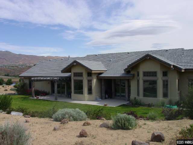 4475 Plateau Road Reno, NV 89519 - Photo 8 of 9 a view of a house with a garden
