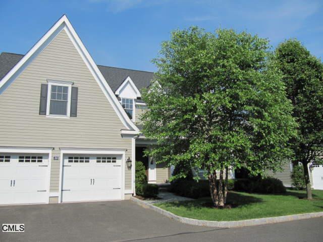 631 Long Ridge Road, Unit 14 14 Stamford, CT 06902 - Photo 1 of 1 a view of a white house next to a road and trees