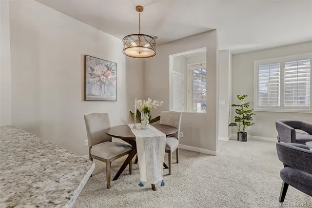 a view of a livingroom with furniture and a window