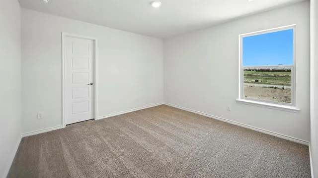 a view of an empty room and window