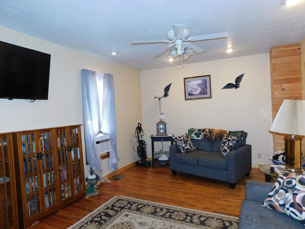 204 1st Avenue Rouseville, PA 16344 - Photo 11 of 37 a living room with furniture and a flat screen tv