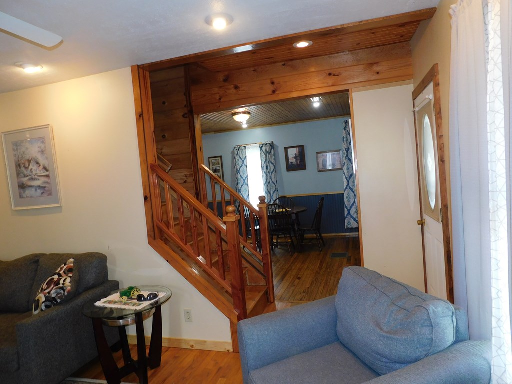 204 1st Avenue Rouseville, PA 16344 - Photo 14 of 37 a living room with furniture and a chandelier