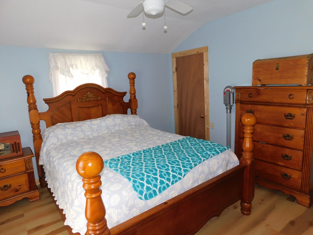 204 1st Avenue Rouseville, PA 16344 - Photo 19 of 37 a bedroom with a bed and dresser