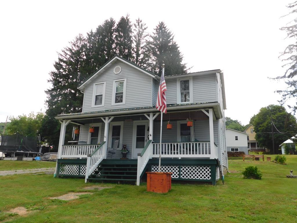 204 1st Avenue Rouseville, PA 16344 - Photo 2 of 37 a front view of a house with a garden