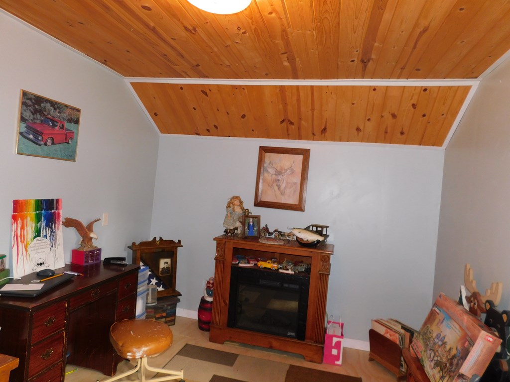 204 1st Avenue Rouseville, PA 16344 - Photo 21 of 37 a view of a workspace with furniture and a fireplace
