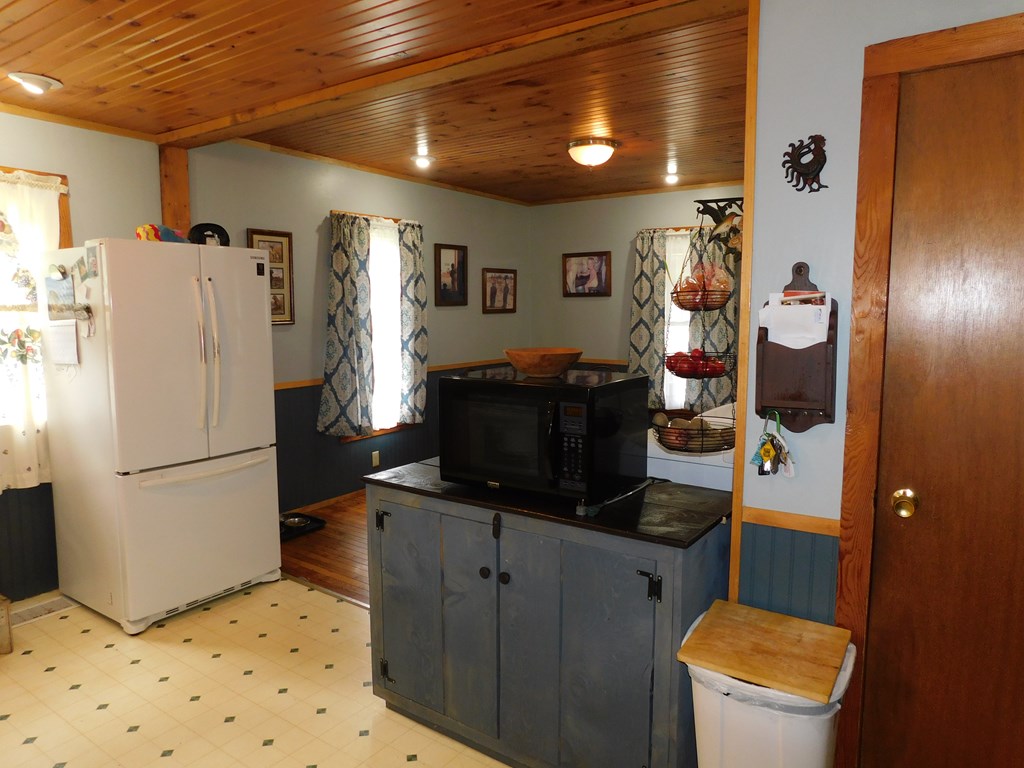 204 1st Avenue Rouseville, PA 16344 - Photo 4 of 37 a white refrigerator freezer sitting inside of a kitchen