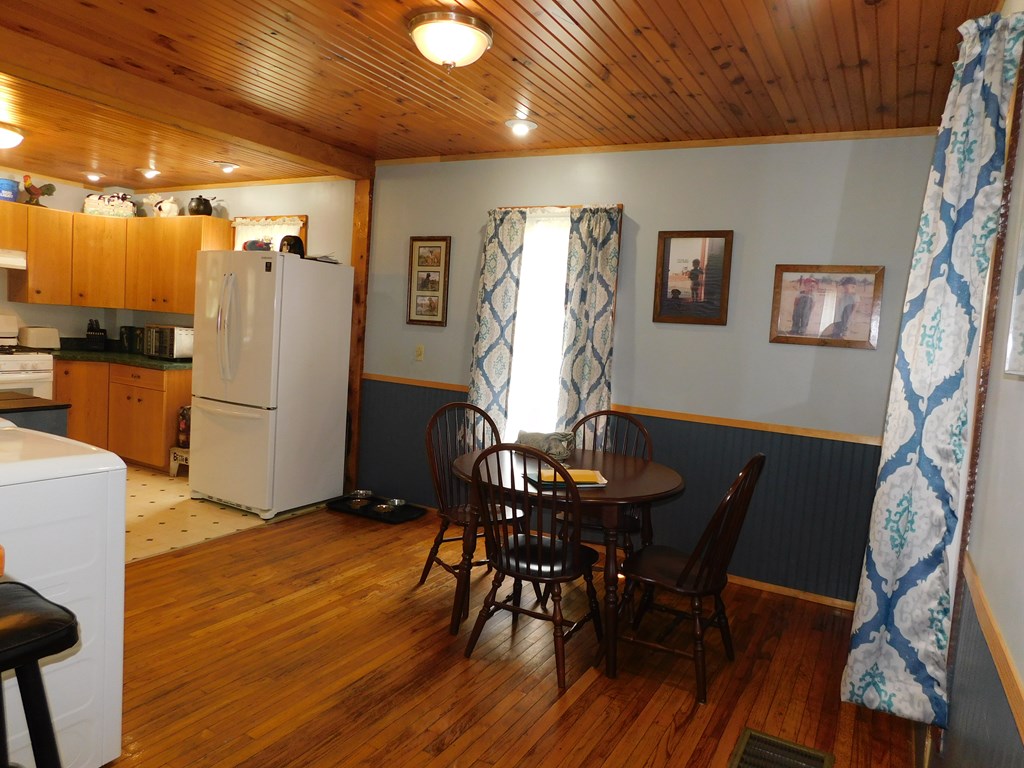 204 1st Avenue Rouseville, PA 16344 - Photo 7 of 37 a view of a dining room with furniture and wooden floor
