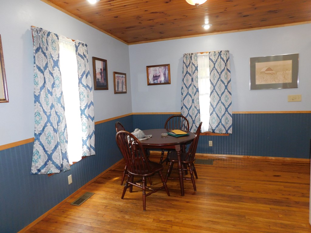 204 1st Avenue Rouseville, PA 16344 - Photo 8 of 37 a view of a dining room with furniture and wooden floor