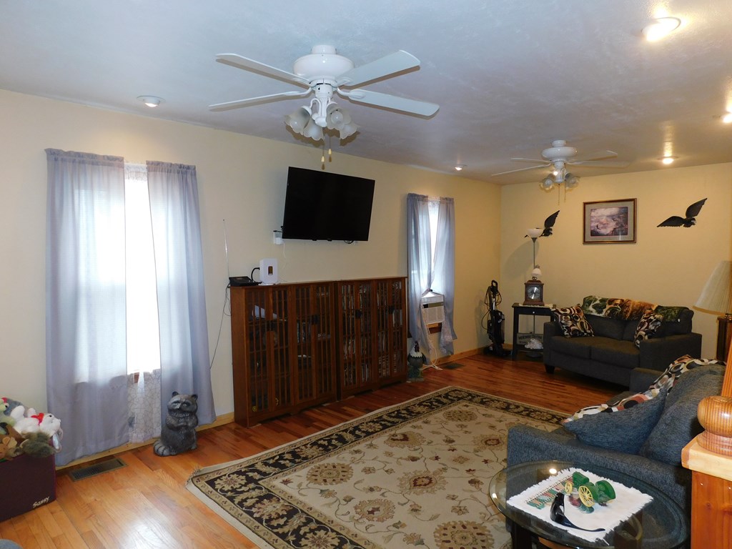 204 1st Avenue Rouseville, PA 16344 - Photo 9 of 37 a living room with furniture and a flat screen tv