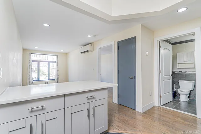 a view of a kitchen cabinets and wooden floor