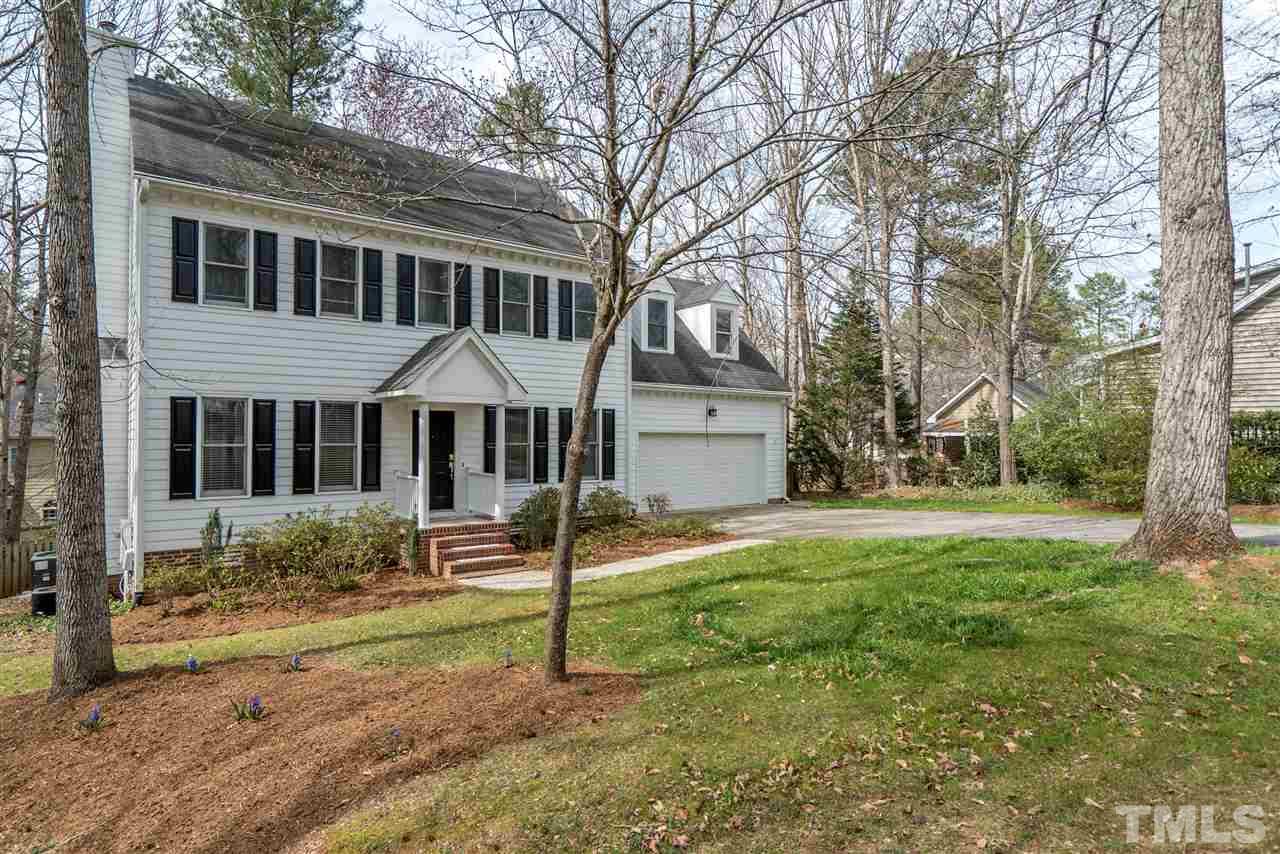 9905 Rimwood Court Raleigh, NC 27613 - Photo 1 of 24 a house with garden in front of it
