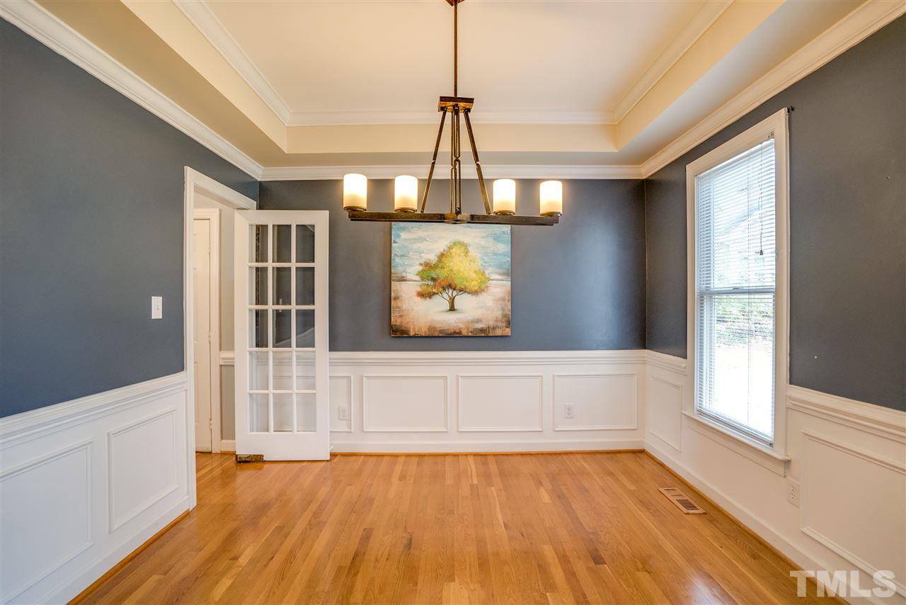 9905 Rimwood Court Raleigh, NC 27613 - Photo 3 of 24 a view of an entryway with wooden floor