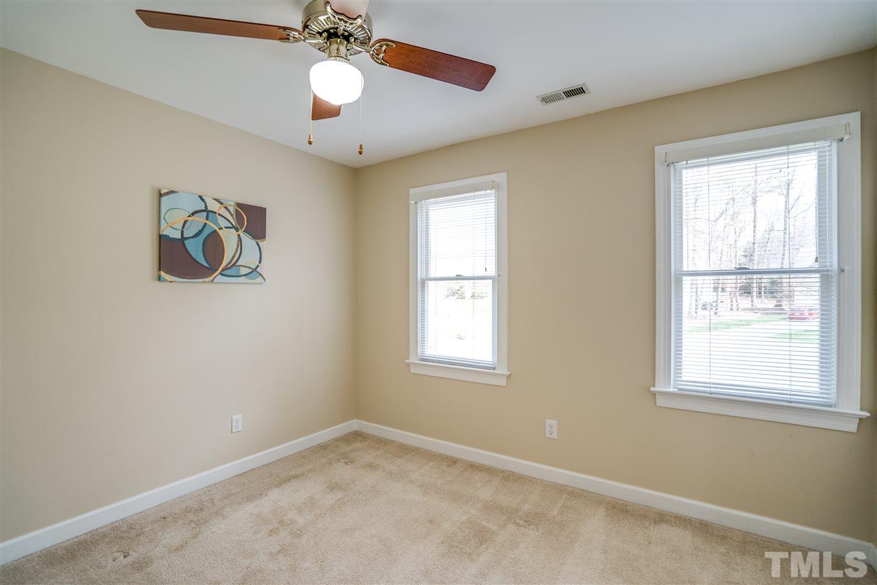 9905 Rimwood Court Raleigh, NC 27613 - Photo 21 of 24 a view of an empty room with a window