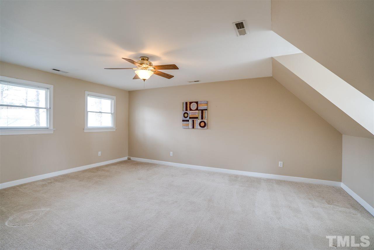 9905 Rimwood Court Raleigh, NC 27613 - Photo 22 of 24 a view of an empty room with a window
